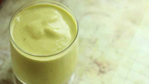 creamy probiotic smoothie in glass promoting adding probiotics to your lifestyle