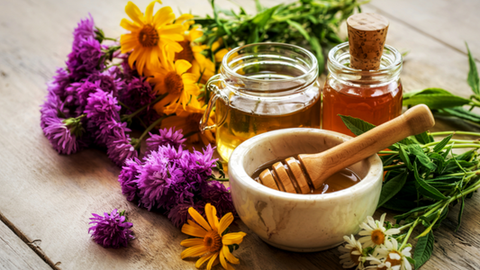 Natural remedies for vaginal odor including honey, herbal flowers, and essential oils on wooden table